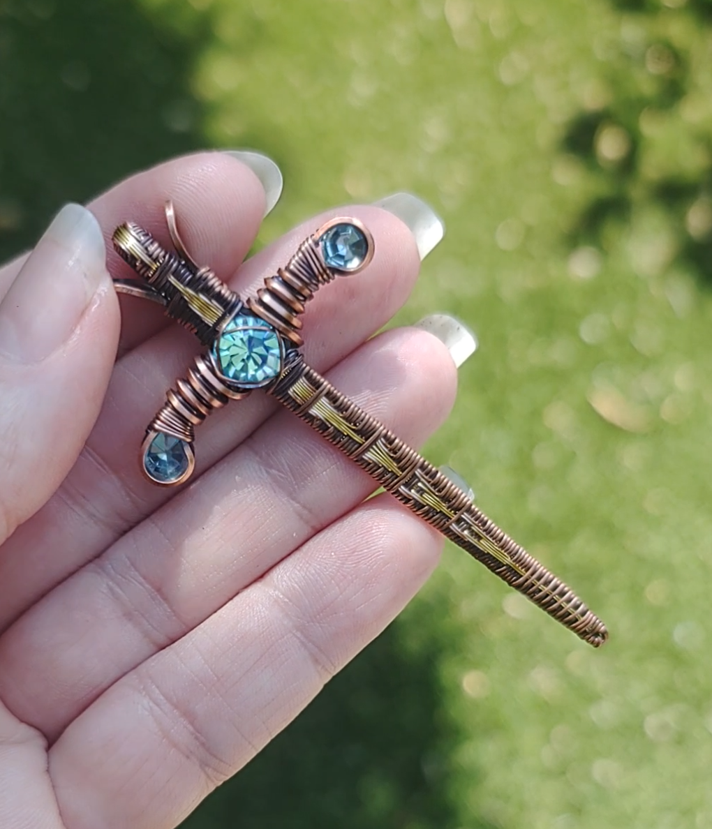Gold Sword ⚔️ with three blue crystals