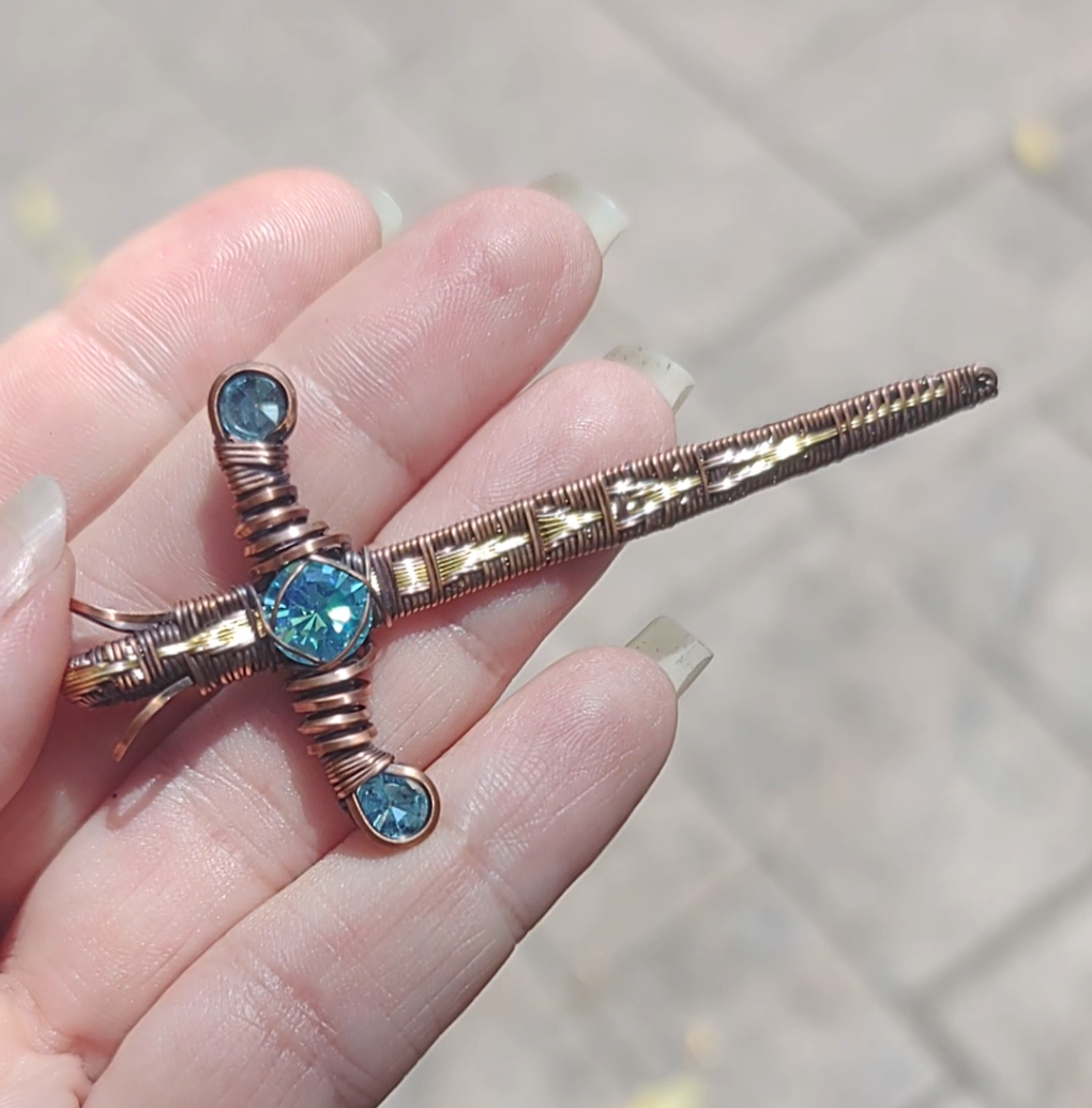 Gold Sword ⚔️ with three blue crystals